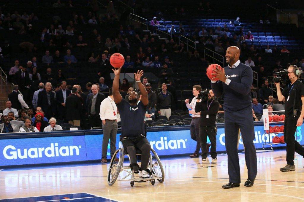 CJsGo | Basketball Hall of Famer Alonzo Mourning played on center court on Nov. 21 with wheelchair hoop star Chris Saint-Remy during Georgetown-Texas half-time.
